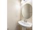 Bathroom features a white pedestal sink and large round mirror at 3039 Potomac River Pkwy, Charlotte, NC 28217