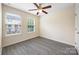 Bedroom featuring a ceiling fan and two windows with neighborhood views at 3039 Potomac River Pkwy, Charlotte, NC 28217