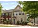 Charming two-story townhome featuring manicured shrubs and covered entryway at 3039 Potomac River Pkwy, Charlotte, NC 28217