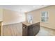 Dining area features a kitchen island with granite countertop and cabinets at 3039 Potomac River Pkwy, Charlotte, NC 28217