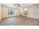 Large living room with neutral walls and wood flooring at 3039 Potomac River Pkwy, Charlotte, NC 28217