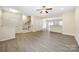 Bright living room with wood floors and staircase at 3039 Potomac River Pkwy, Charlotte, NC 28217