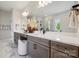 Modern bathroom featuring a double vanity, large mirror, and sleek fixtures at 3058 Tramore Dr, Harrisburg, NC 28075