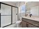 Stylish bathroom with walk-in shower, modern vanity and sink, toilet, and bright natural light at 3058 Tramore Dr, Harrisburg, NC 28075