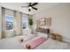 Versatile bedroom with space for exercise, featuring lots of natural light and neutral decor at 3058 Tramore Dr, Harrisburg, NC 28075