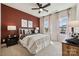 Cozy bedroom with a soccer theme, featuring large windows for natural light and comfortable furnishings at 3058 Tramore Dr, Harrisburg, NC 28075