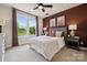 Comfortable bedroom with large window for ample natural light and stylish decor at 3058 Tramore Dr, Harrisburg, NC 28075