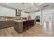 This gourmet kitchen features an island with seating, stainless steel appliances, and modern pendant lighting at 3058 Tramore Dr, Harrisburg, NC 28075