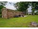 Expansive backyard featuring a brick home, patio area and well-maintained lawn at 3424 Autumn Dr, Gastonia, NC 28056