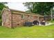 Brick house with a large backyard and a patio area perfect for relaxing and entertaining at 3424 Autumn Dr, Gastonia, NC 28056