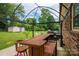 Backyard with a wooden bar area and seating, perfect for outdoor entertaining in a large yard at 3424 Autumn Dr, Gastonia, NC 28056