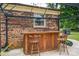 The outdoor bar features a wooden facade and seating for two at 3424 Autumn Dr, Gastonia, NC 28056