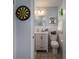 Bathroom with stylish vanity, toilet, and dartboard decor at 3424 Autumn Dr, Gastonia, NC 28056