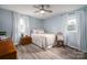 Bedroom with wood-look floors, dresser, and plenty of natural light at 3424 Autumn Dr, Gastonia, NC 28056