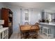 Cozy dining area adjacent to kitchen with hardwood table and chair set at 3424 Autumn Dr, Gastonia, NC 28056