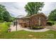 Backyard featuring a brick home and an outdoor seating area at 3424 Autumn Dr, Gastonia, NC 28056