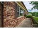Close-up of brick facade with neat landscaping and dark shutters, creating a warm, welcoming atmosphere at 3424 Autumn Dr, Gastonia, NC 28056