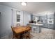 Spacious eat-in kitchen area with bar seating and a dining table at 3424 Autumn Dr, Gastonia, NC 28056