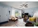 Comfortable living room with lots of natural light, hardwood floors, and stylish rug at 3424 Autumn Dr, Gastonia, NC 28056