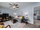 Comfortable living room with stylish decor, ceiling fan, and hardwood floors at 3424 Autumn Dr, Gastonia, NC 28056