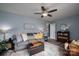 Inviting living room with neutral tones, ceiling fan, and stylish rug at 3424 Autumn Dr, Gastonia, NC 28056