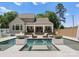 Resort style backyard with luxurious pool and fire bowls plus covered patio seating area at 4021 Redwood Ave, Charlotte, NC 28205