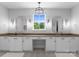 Beautiful bathroom featuring double vanity with decorative mirrors and detailed floor tiles at 4021 Redwood Ave, Charlotte, NC 28205