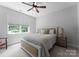 Cozy bedroom with a comfortable bed, natural light, and neutral decor at 4021 Redwood Ave, Charlotte, NC 28205