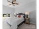 Inviting bedroom with a patterned bedspread and plush pillows, bathed in soft natural light at 4021 Redwood Ave, Charlotte, NC 28205