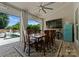 Covered dining area featuring an open-air design with seating for ten and a pool view at 4021 Redwood Ave, Charlotte, NC 28205