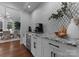 Charming kitchen bar features granite countertops and a stylish backsplash at 4021 Redwood Ave, Charlotte, NC 28205