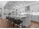 Well-lit kitchen with an island with barstool seating and modern stainless steel appliances at 4021 Redwood Ave, Charlotte, NC 28205