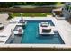 Aerial view of a luxury backyard pool complete with sunbathing chairs and outdoor seating area at 4021 Redwood Ave, Charlotte, NC 28205
