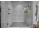 Modern tiled shower with glass enclosure and stylish fixtures at 4021 Redwood Ave, Charlotte, NC 28205