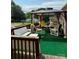 Outdoor seating area on the back deck with a gazebo and green carpeting at 403 Kings Dr, Cherryville, NC 28021