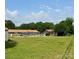 Full backyard view including a pool, well maintained grass and a brick house at 403 Kings Dr, Cherryville, NC 28021