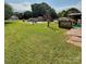 Large backyard featuring an above ground pool and wooden deck at 403 Kings Dr, Cherryville, NC 28021