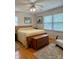 Comfortable bedroom has hardwood floors, a ceiling fan, and bright sunny windows at 403 Kings Dr, Cherryville, NC 28021