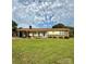 Inviting single-story home featuring a brick facade and a spacious green lawn at 403 Kings Dr, Cherryville, NC 28021