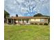 Inviting single-story home featuring a brick facade and a spacious green lawn at 403 Kings Dr, Cherryville, NC 28021