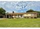 Charming single-story home with a covered front porch and well-maintained lawn at 403 Kings Dr, Cherryville, NC 28021