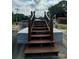 Wooden stairs lead to a partially covered above-ground pool at 403 Kings Dr, Cherryville, NC 28021