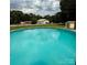 Wide angle of an in-ground backyard pool with ample sunlight at 403 Kings Dr, Cherryville, NC 28021