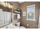 Charming bathroom with updated fixtures and natural light at 4430 Bravery Sw Pl, Concord, NC 28027