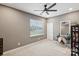 Bedroom with neutral tones, bright window, vanity and modern ceiling fan at 4430 Bravery Sw Pl, Concord, NC 28027
