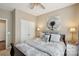 Cozy bedroom showcasing neutral tones, soft carpet, and a large window for natural lighting at 4430 Bravery Sw Pl, Concord, NC 28027