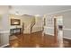Elegant foyer showcasing hardwood floors, an ornate staircase, and stylish decor at 4430 Bravery Sw Pl, Concord, NC 28027