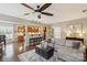 Open-concept living room boasts hardwood floors, recessed lights, and seamless flow to the kitchen at 4430 Bravery Sw Pl, Concord, NC 28027