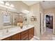 A luxurious bathroom features double sinks, a glass-enclosed shower, and a separate bathtub at 4430 Bravery Sw Pl, Concord, NC 28027