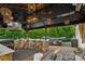 Outdoor kitchen offers a grill, bar with seating, hot tub, and comfortable furniture at 4430 Bravery Sw Pl, Concord, NC 28027